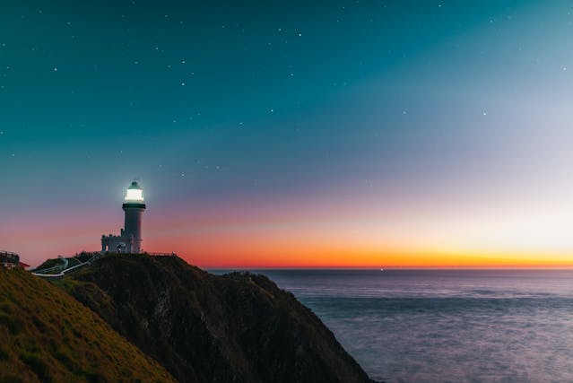 Byron Bay Lighthouse cosy The Byron Bay lighthouse with a beautiful sunrise representing hope, connection and rebuilding trust.