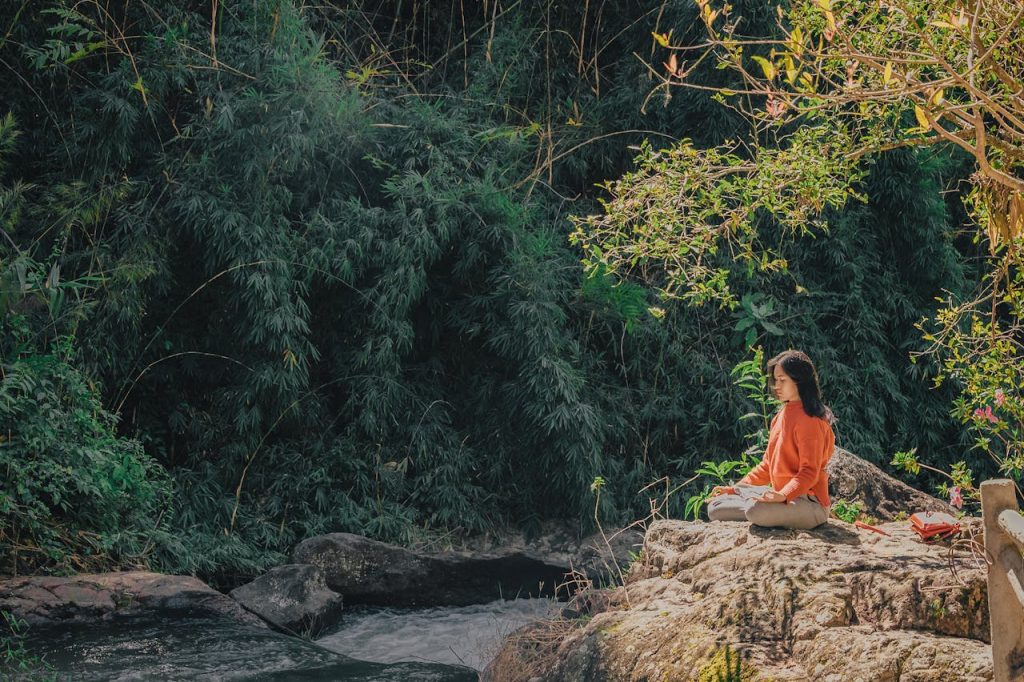 Sitting in nature, the renewal of healing after betrayal A woman sitting in nature, the renewal of healing after betrayal